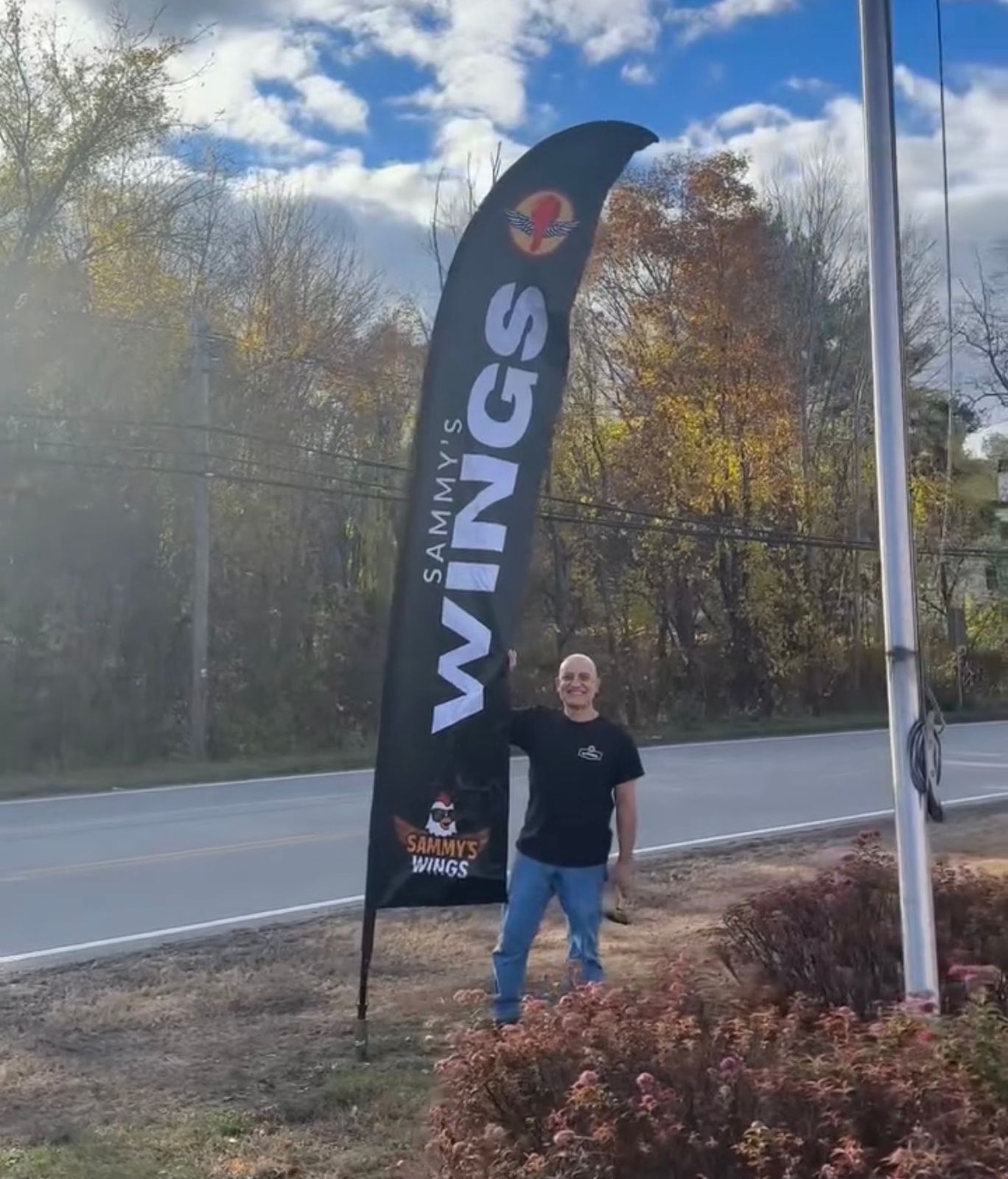 Custom feather flag outside a business