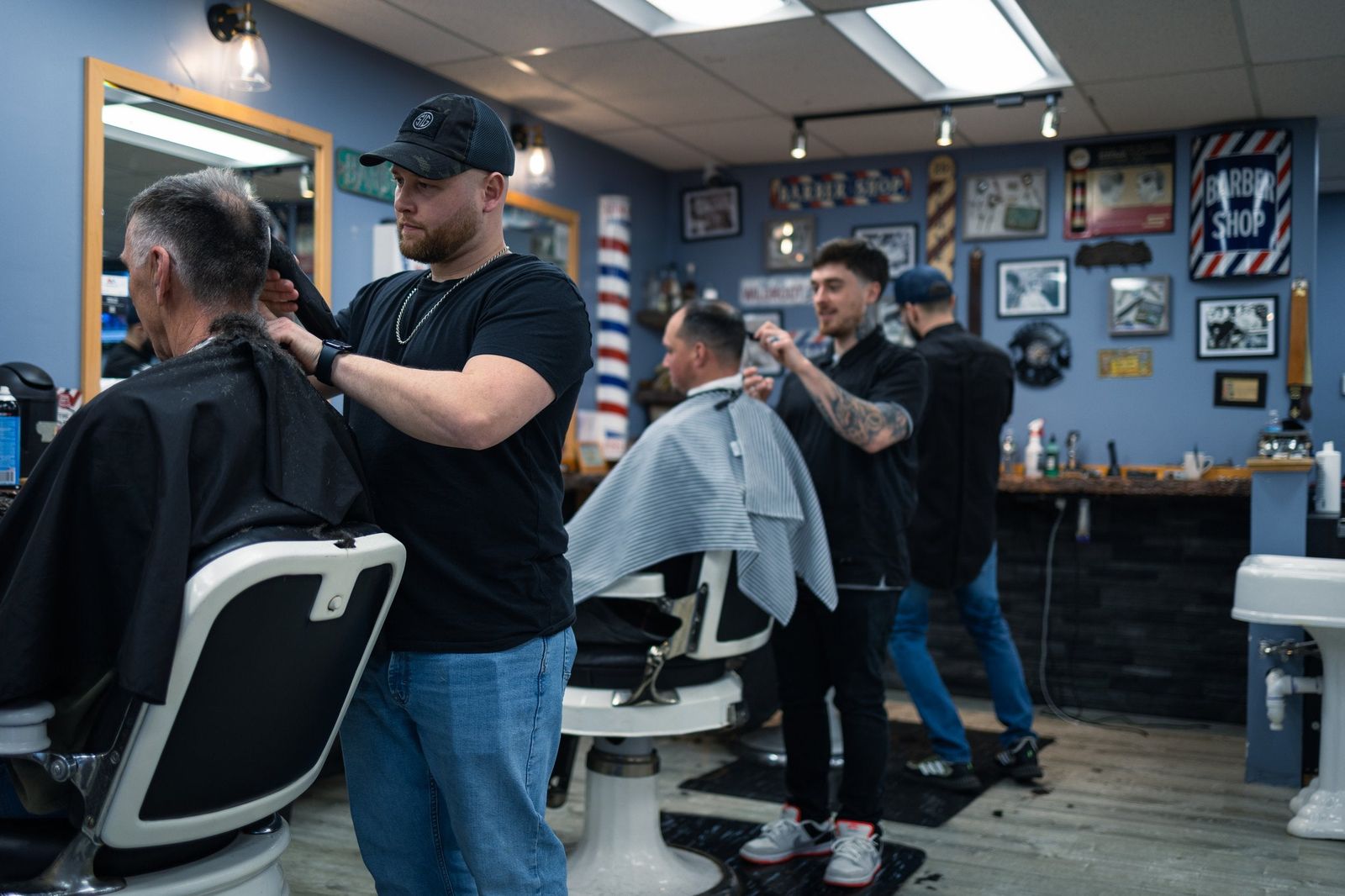 Barber at work at The Classy Edge