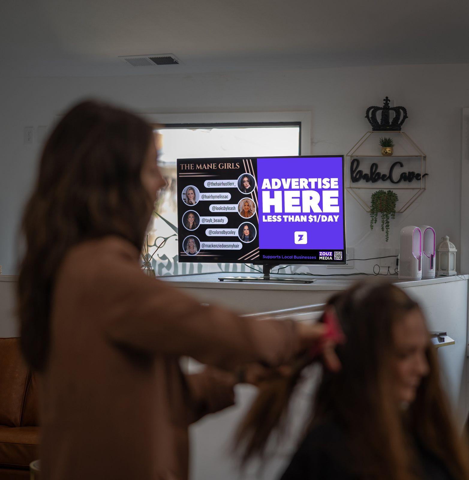 Screen ad at Mane Obsession salon, Windham
