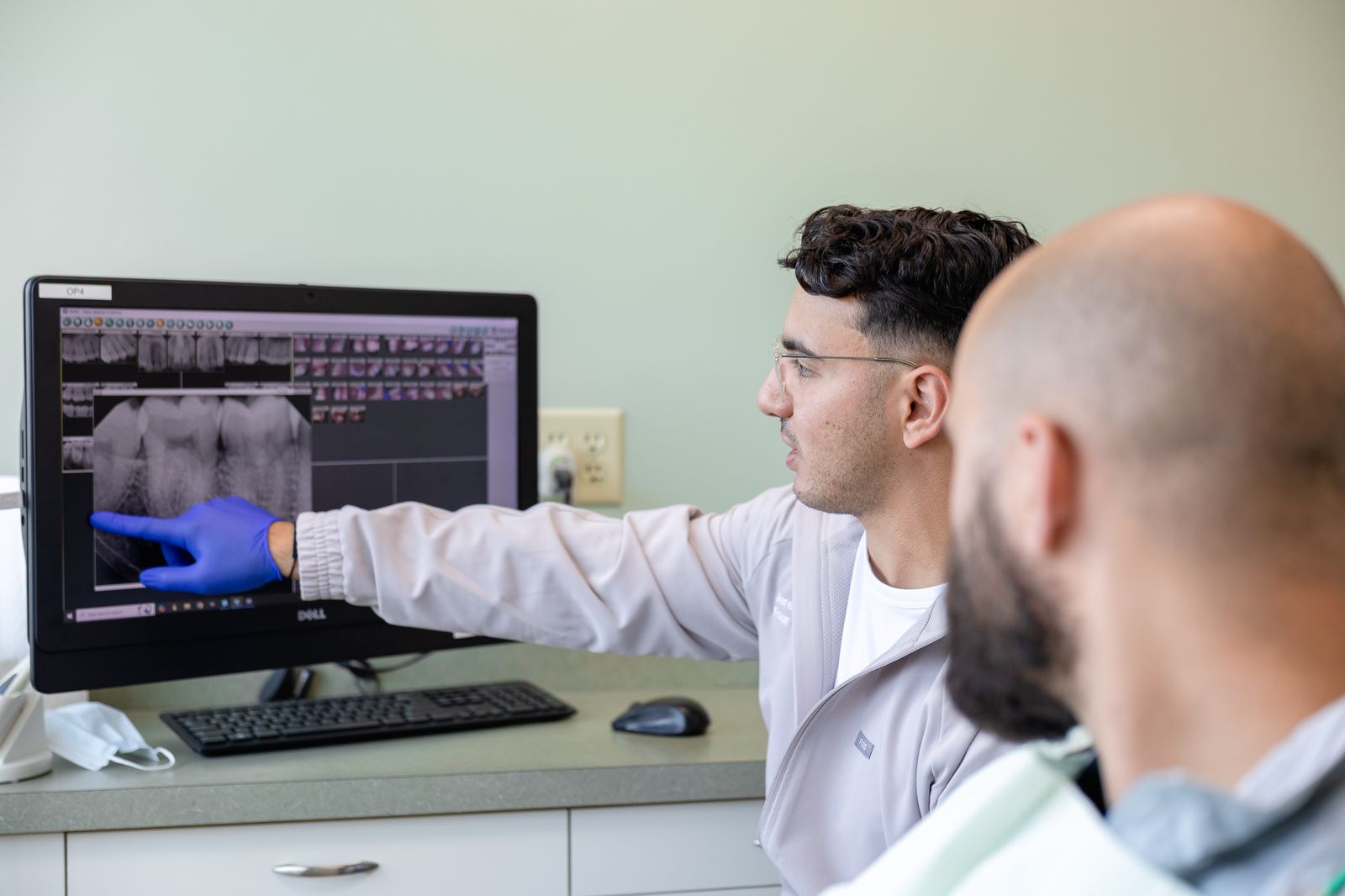 Dentist reviewing x-rays with a patient