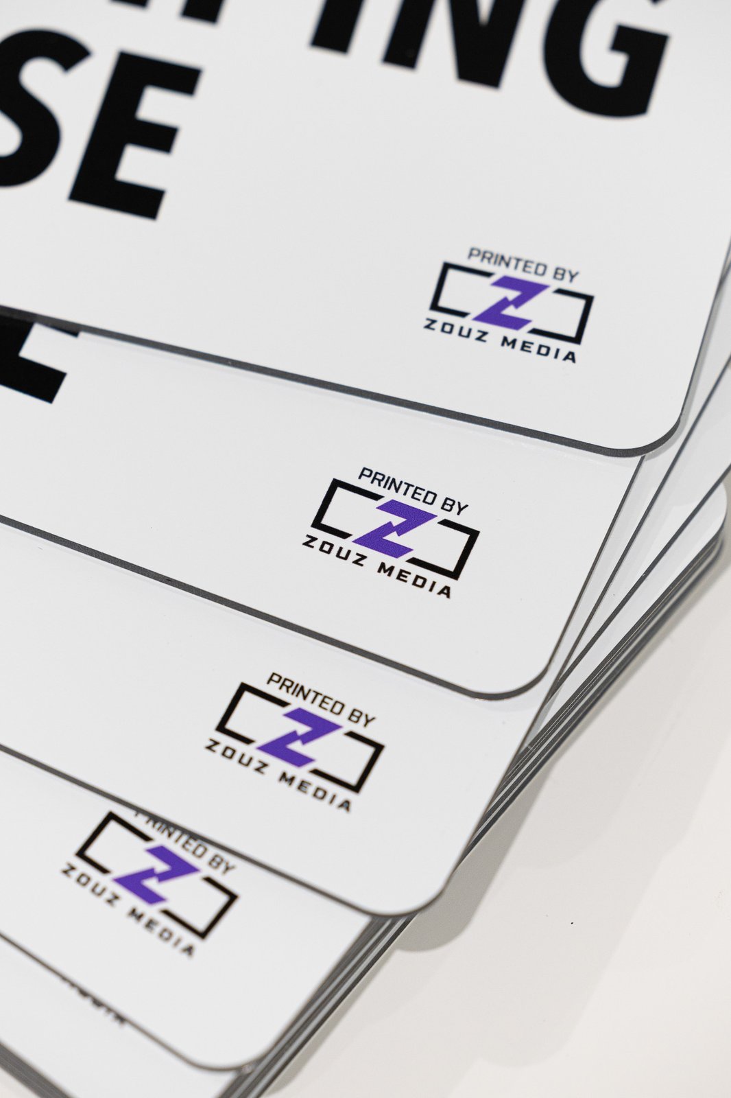 Stack of Zouz Media business cards