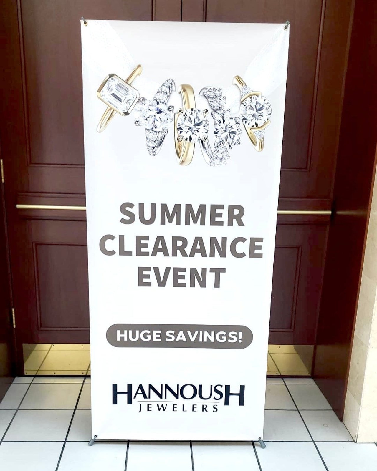 Retractable banner for a summer clearance event