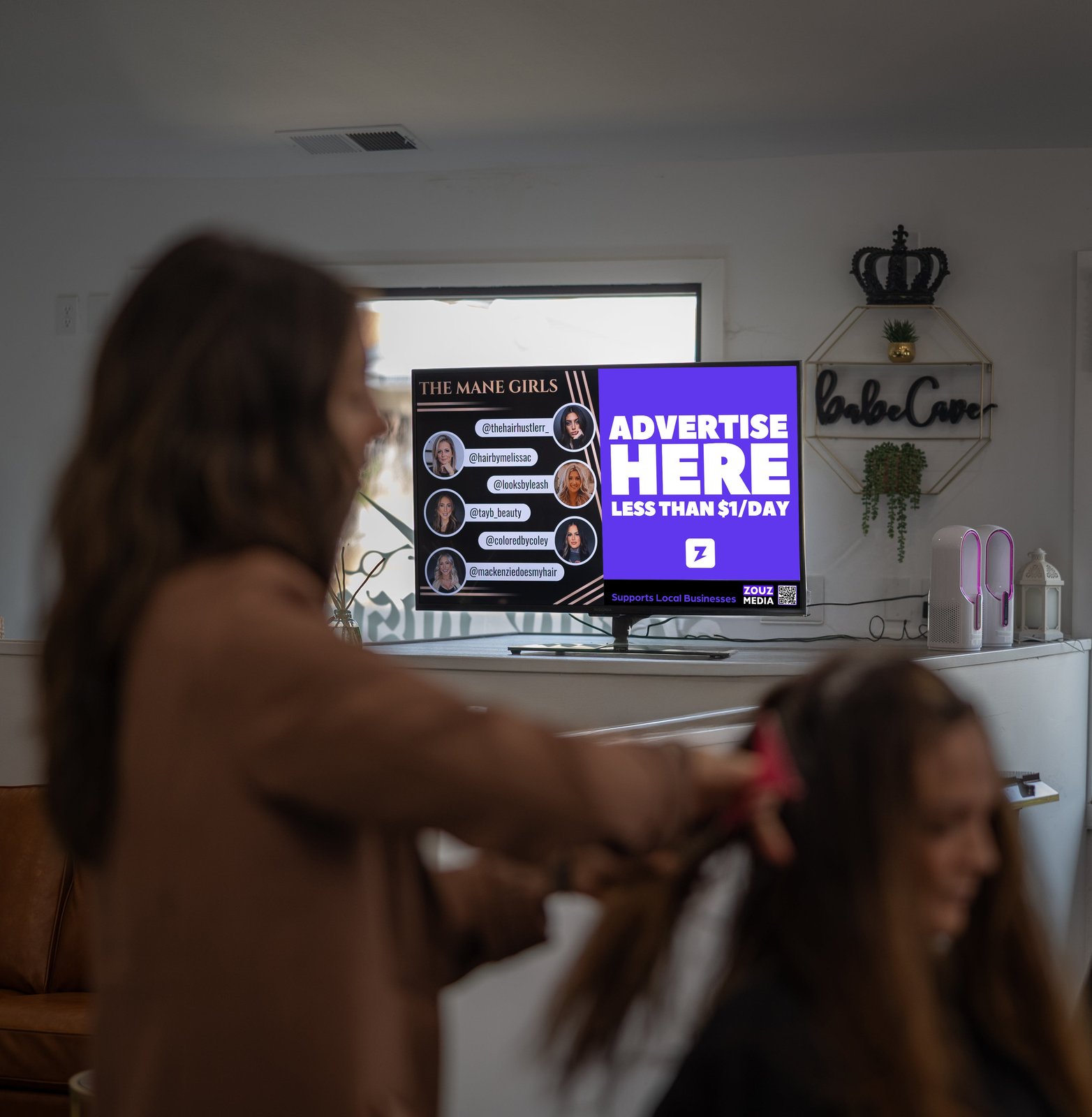 Screen ad playing at Mane Obsession salon in Windham