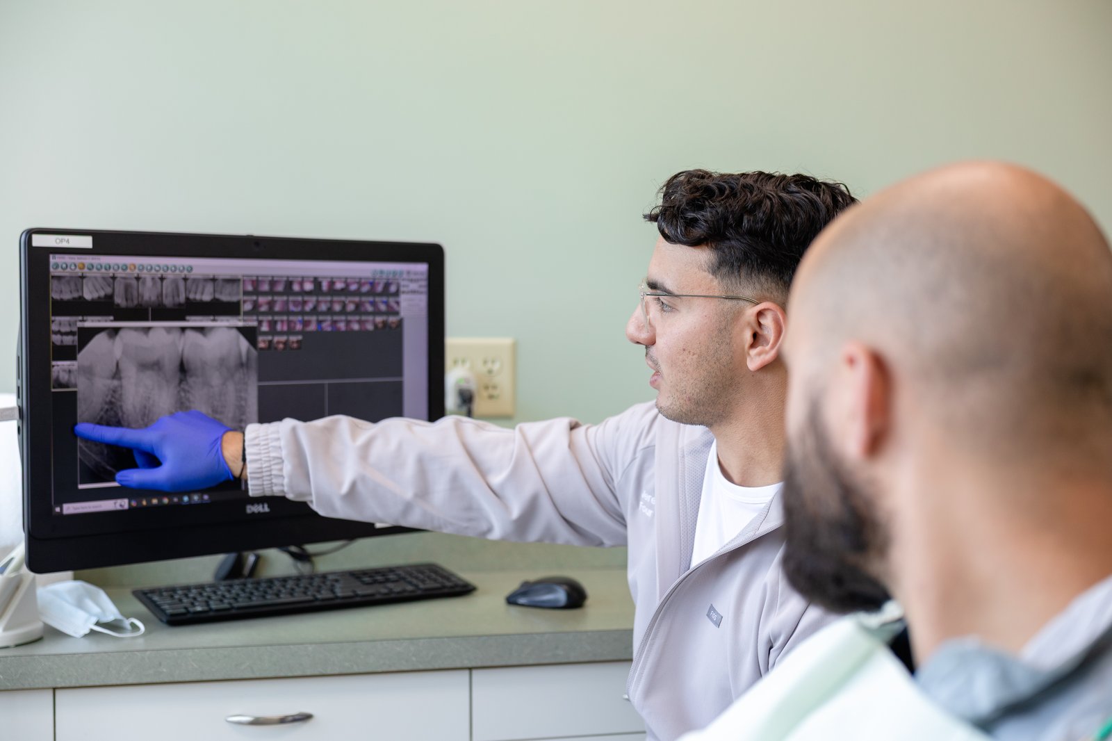 Dentist reviewing x-rays with a patient