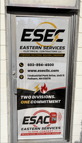 ESEC and ESAC Eastern Services perforated window graphic on a glass door in Pelham, NH