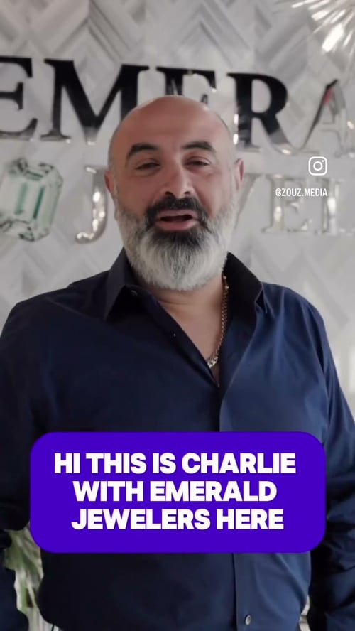 Charly Chakar in front of the Emerald Jewelers sign in his store