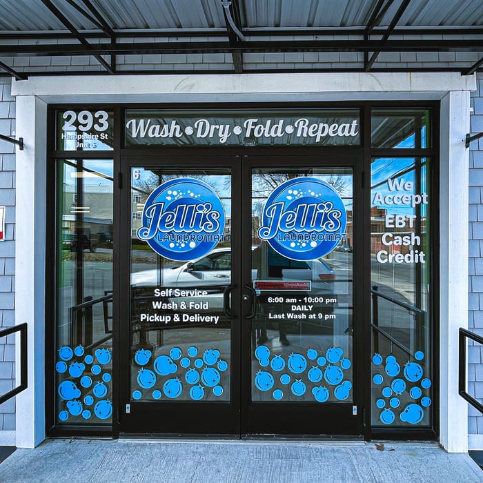 Finished window graphics on a laundromat storefront