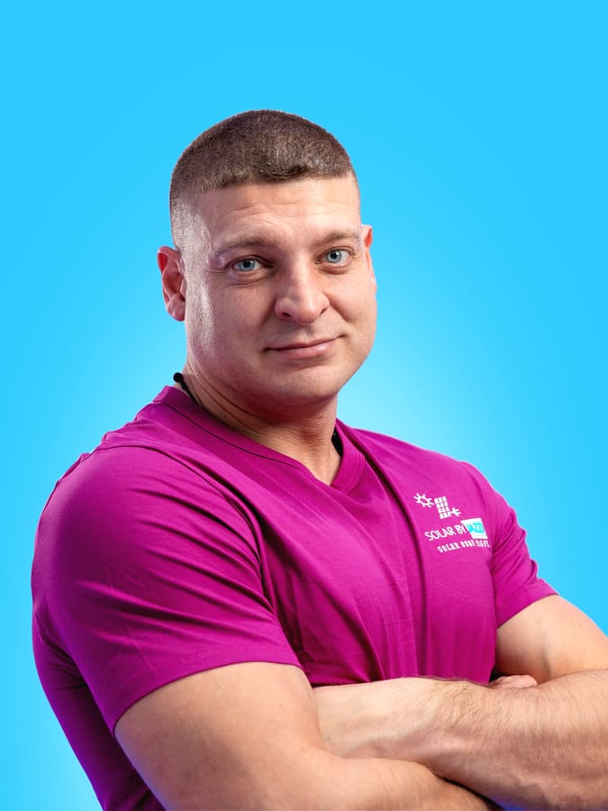 Professional headshot on a colored backdrop