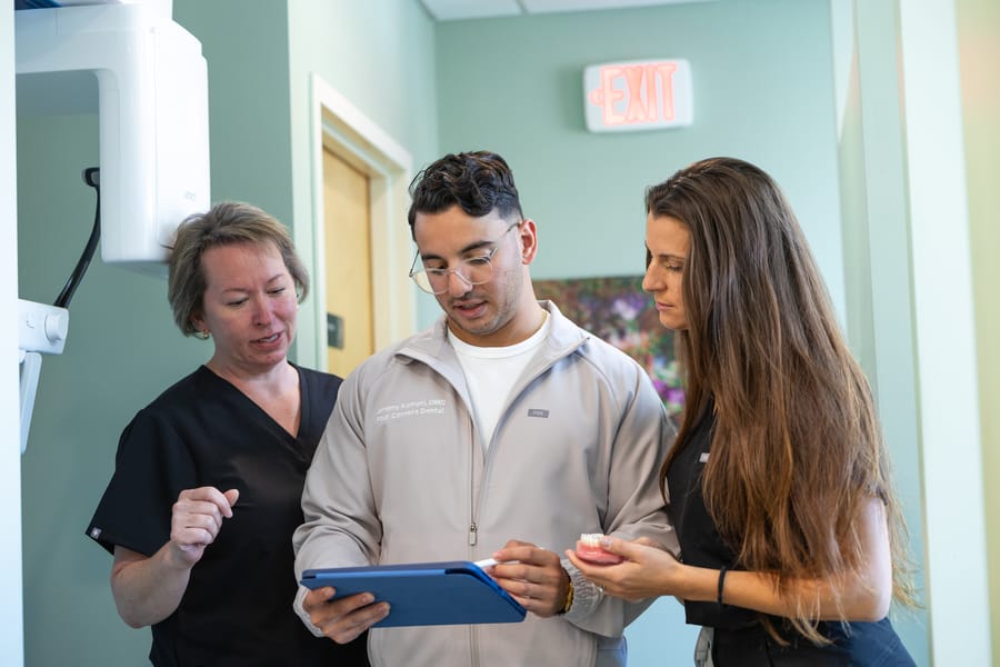 Dentist talking with patients
