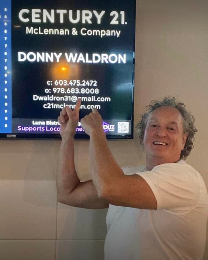 Real estate agent with his Pixel Billboards screen ad