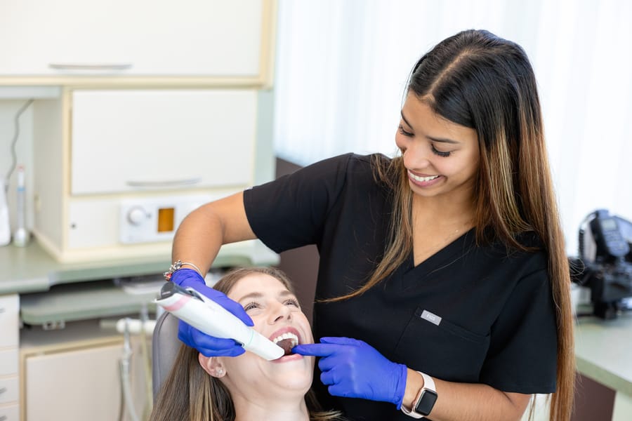 Hygienist at work in the operatory