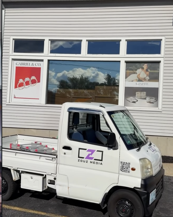 Naser Diamonds windows with perforated brand graphics